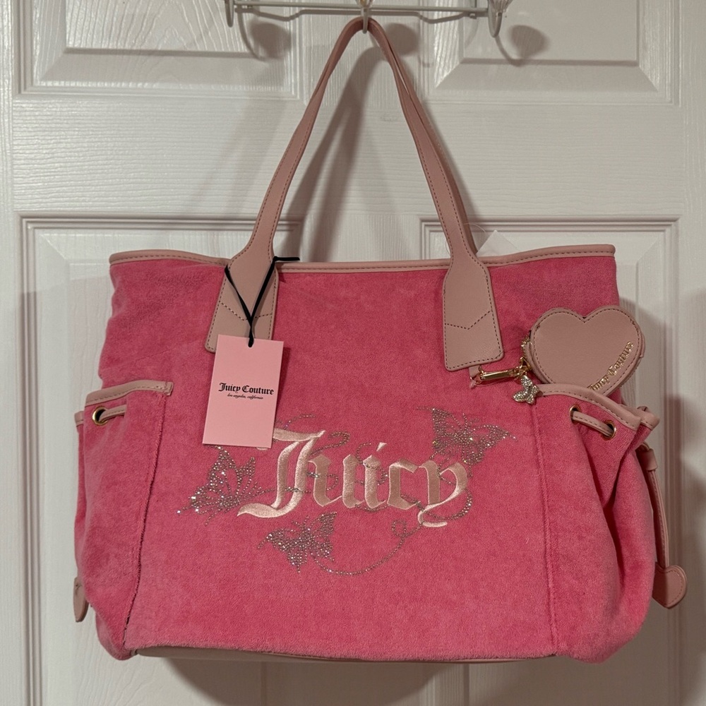 juicy couture wingin it tote & wing it mini wristlet

Approx 14 x 12 x 7 inch